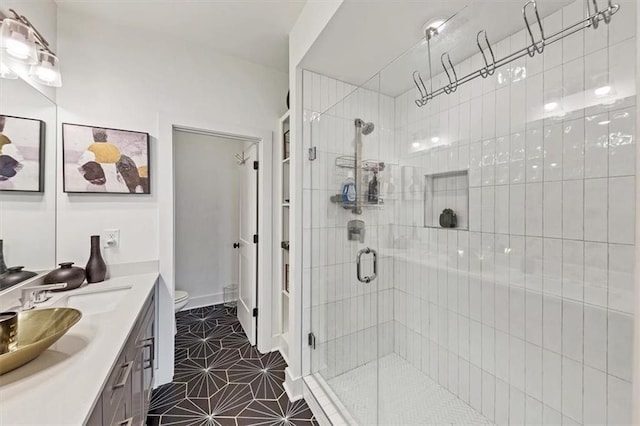 701 Pryor St SW Unit 5, Atlanta, GA 30315 - full bathroom featuring a shower stall, toilet, vanity, and tile patterned floors