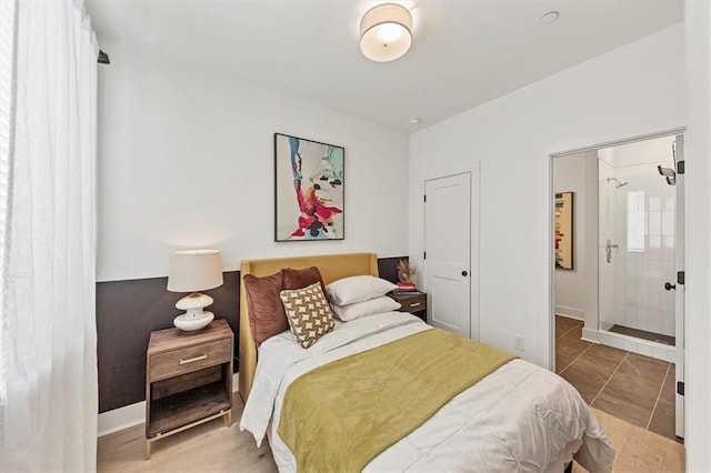 701 Pryor St SW Unit 5, Atlanta, GA 30315 - bedroom with tile patterned flooring, ensuite bathroom, and baseboards