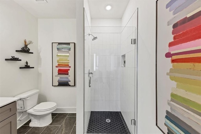 701 Pryor St SW Unit 5, Atlanta, GA 30315 - bathroom featuring tile patterned flooring, a shower stall, toilet, vanity, and baseboards