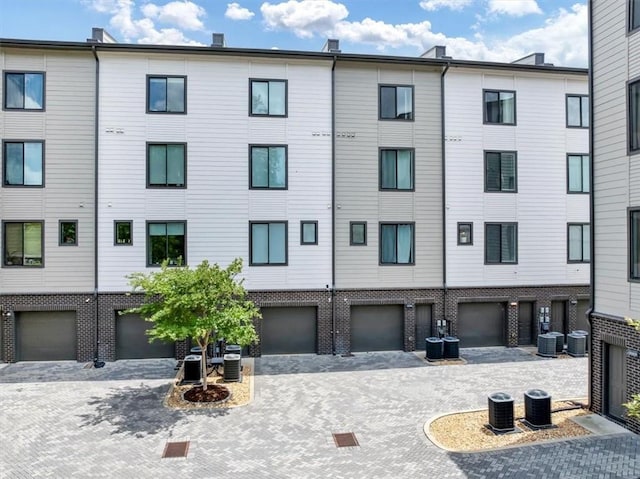 701 Pryor St SW Unit 5, Atlanta, GA 30315 - view of building exterior with central air condition unit and a garage