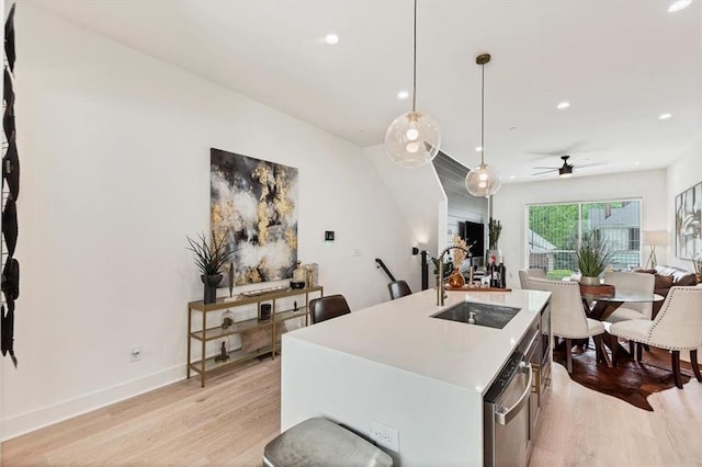 701 Pryor St SW Unit 5, Atlanta, GA 30315 - kitchen with a sink, stainless steel dishwasher, open floor plan, light wood-style floors, and recessed lighting