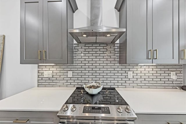 701 Pryor St SW Unit 5, Atlanta, GA 30315 - kitchen featuring extractor fan, gray cabinetry, tasteful backsplash, stainless steel electric range, and light countertops