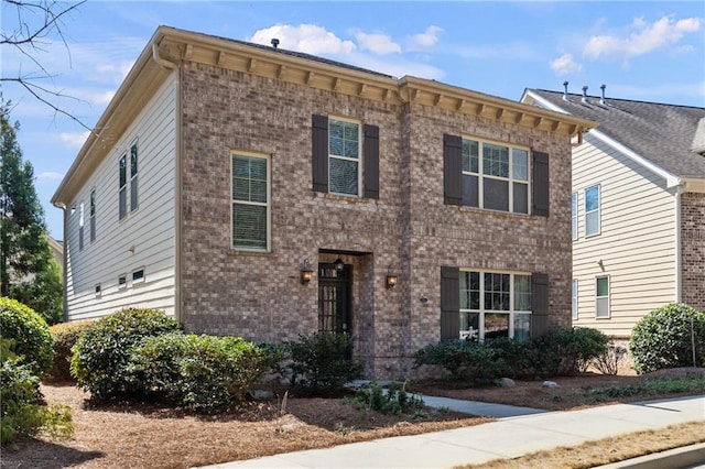 view of front of property featuring brick siding