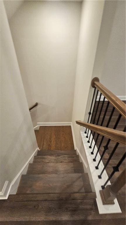 staircase featuring hardwood / wood-style floors