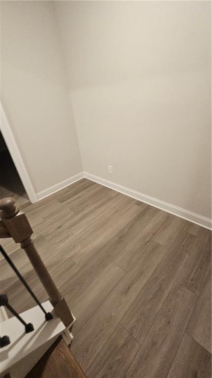 spare room with dark hardwood / wood-style floors