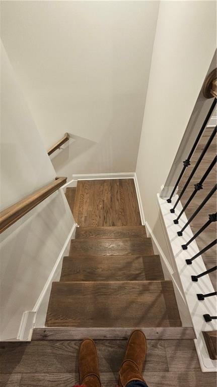 stairway with wood-type flooring