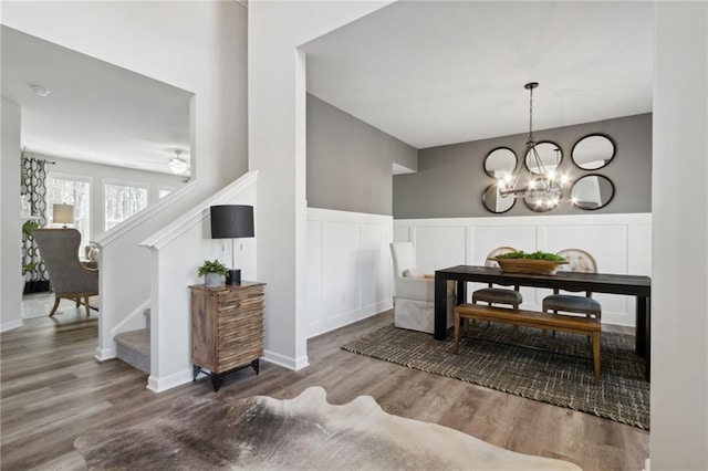 dining room featuring hardwood / wood-style floors and an inviting chandelier