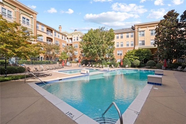 view of pool featuring a community hot tub