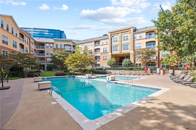 view of pool featuring a patio