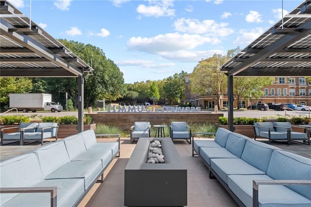 view of patio featuring an outdoor living space and a pergola