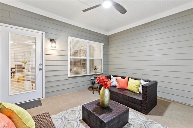 view of patio / terrace with ceiling fan and an outdoor living space