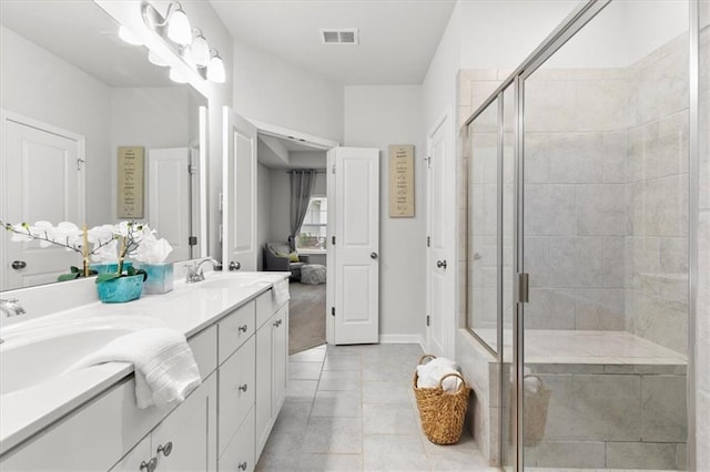 bathroom with tile patterned flooring, visible vents, a shower stall, and double vanity