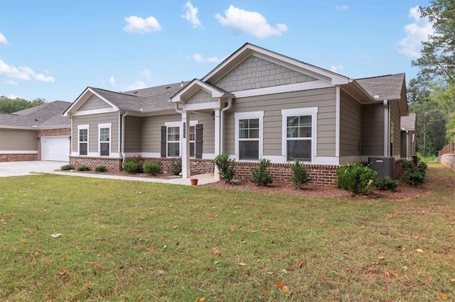 craftsman inspired home featuring a garage, driveway, brick siding, and a front lawn