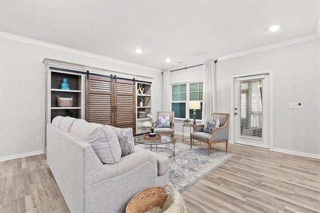 living room with baseboards, ornamental molding, recessed lighting, and light wood-style floors