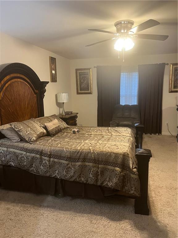 bedroom with ceiling fan and light colored carpet