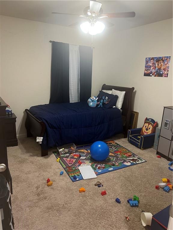 bedroom with carpet floors and ceiling fan