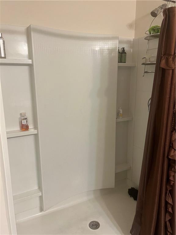 bathroom with walk in shower