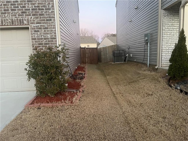 property exterior at dusk with a garage