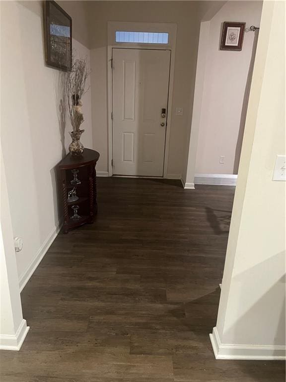 hall with dark hardwood / wood-style floors