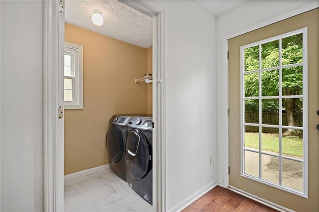 2983 Albright Commons NW, Kennesaw, GA 30144 - laundry area featuring independent washer and dryer, healthy amount of natural light, and marble finish flooring