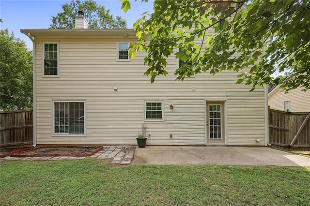 2983 Albright Commons NW, Kennesaw, GA 30144 - back of property featuring a fenced backyard, a chimney, and a patio