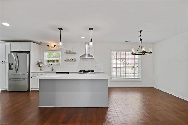 2983 Albright Commons NW, Kennesaw, GA 30144 - kitchen with stainless steel fridge, wall chimney range hood, stove, light countertops, and recessed lighting