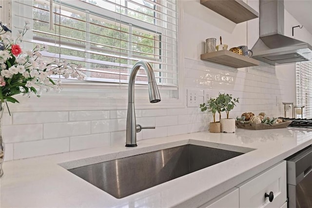 2983 Albright Commons NW, Kennesaw, GA 30144 - kitchen with wall chimney exhaust hood, tasteful backsplash, white cabinetry, light stone countertops, and stainless steel dishwasher