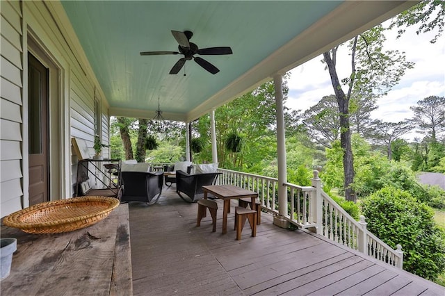 deck with an outdoor hangout area and ceiling fan