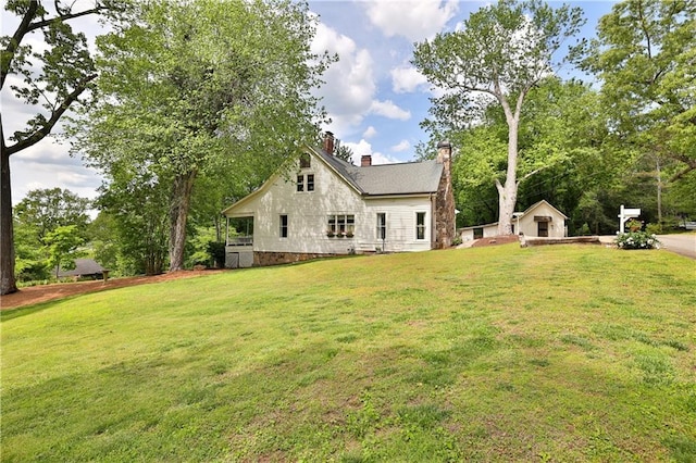 rear view of house with a lawn