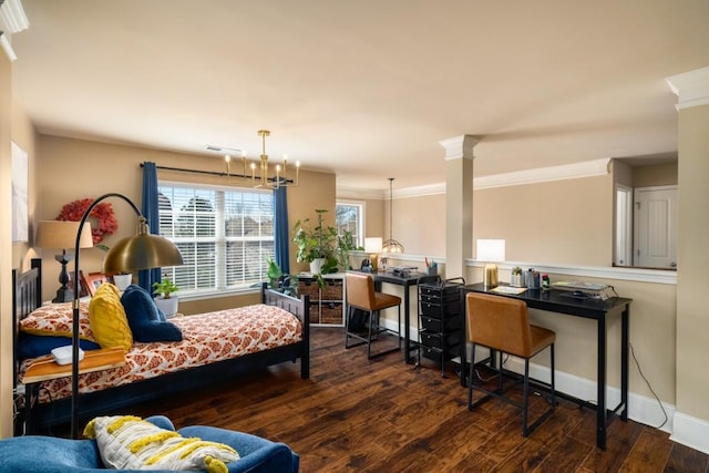 interior space with baseboards, ornamental molding, wood finished floors, and ornate columns