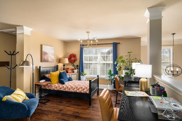 interior space featuring wood finished floors, decorative columns, and an inviting chandelier