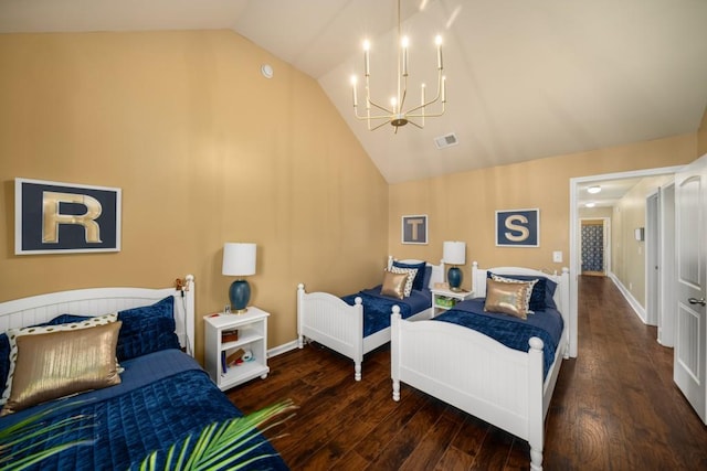 bedroom featuring baseboards, wood finished floors, and an inviting chandelier