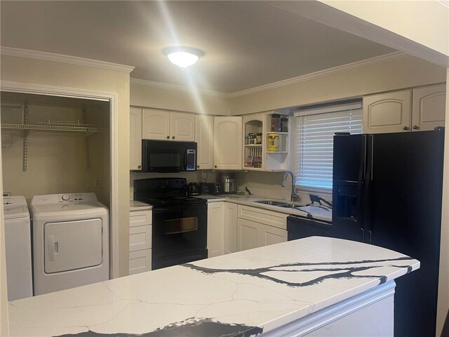 kitchen with white cabinets, sink, black appliances, separate washer and dryer, and ornamental molding