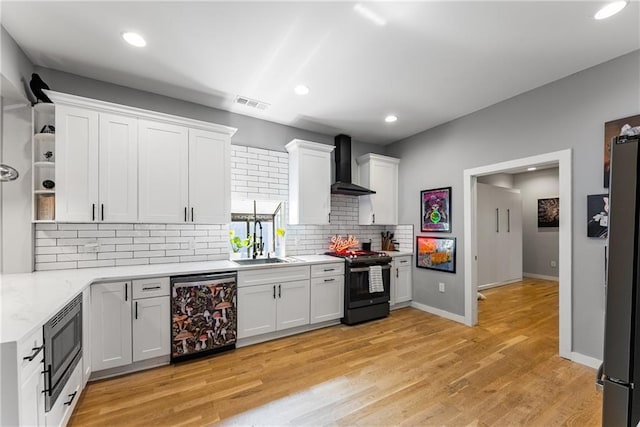 611 Pickett St SE, Atlanta, GA 30316 - kitchen with appliances with stainless steel finishes, wall chimney range hood, open shelves, a sink, and tasteful backsplash