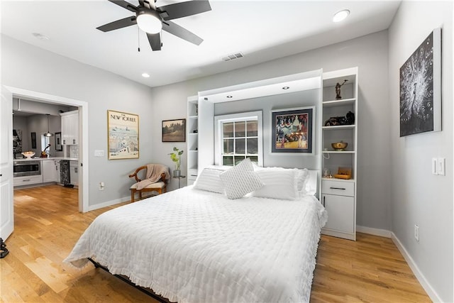 611 Pickett St SE, Atlanta, GA 30316 - bedroom featuring light wood-type flooring, baseboards, recessed lighting, connected bathroom, and a ceiling fan