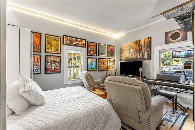 611 Pickett St SE, Atlanta, GA 30316 - bedroom with multiple windows, ornamental molding, and wood finished floors