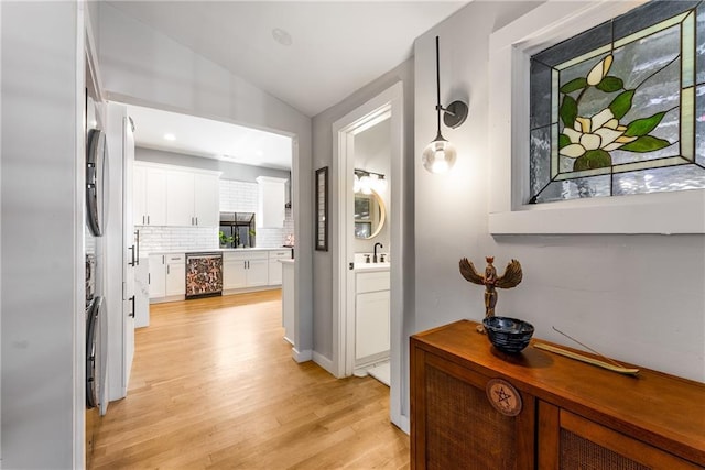 611 Pickett St SE, Atlanta, GA 30316 - hallway with wine cooler, lofted ceiling, light wood-style floors, and a sink