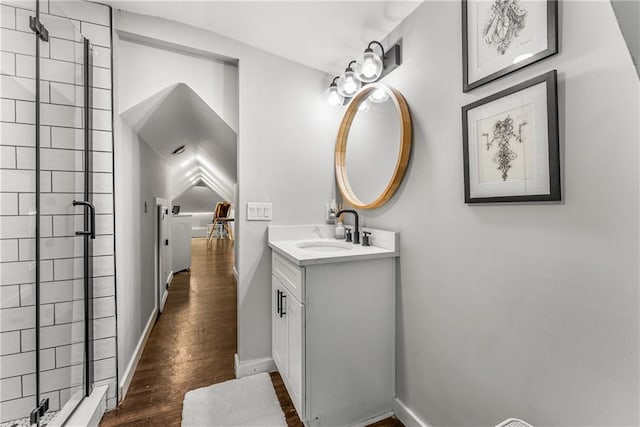611 Pickett St SE, Atlanta, GA 30316 - full bath featuring vanity, hardwood / wood-style floors, a stall shower, and baseboards