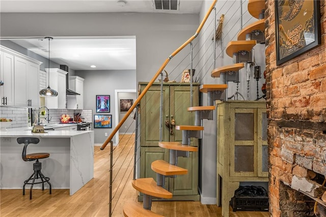 611 Pickett St SE, Atlanta, GA 30316 - staircase with wood finished floors, baseboards, and recessed lighting