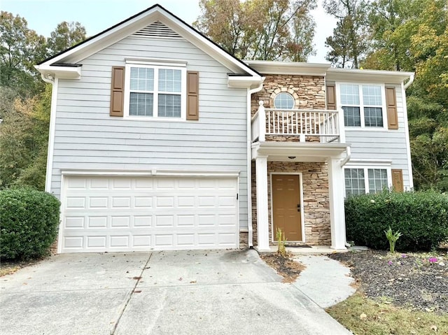 view of front of house with a balcony and a garage