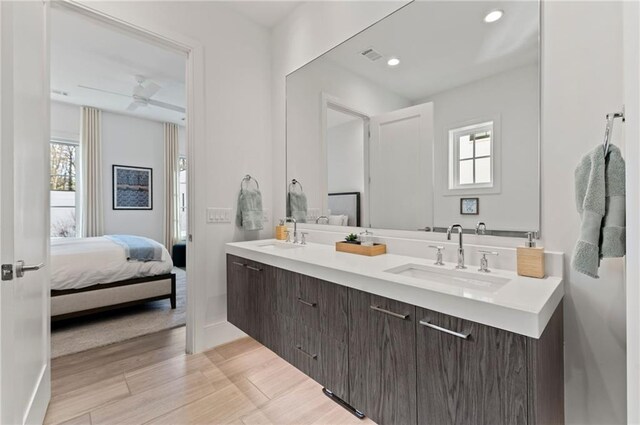 bathroom featuring ceiling fan and vanity