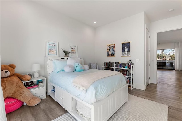 bedroom featuring wood-type flooring