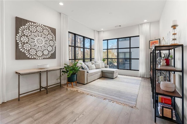 sitting room with light hardwood / wood-style floors