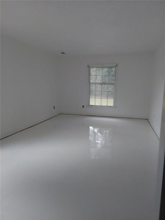 2968 Parc Lorraine, Lithonia, GA 30038 - unfurnished room featuring finished concrete flooring