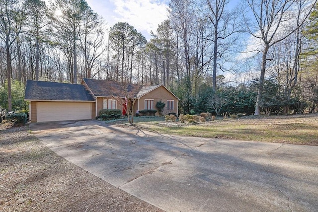 ranch-style home featuring a garage