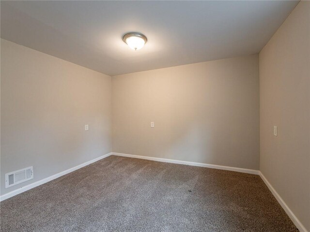 spare room featuring carpet floors