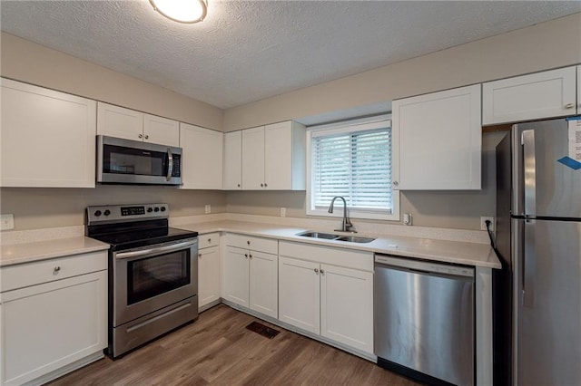 kitchen featuring appliances with stainless steel finishes and white cabinets