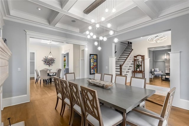 dining room featuring beam ceiling, crown molding, coffered ceiling, and hardwood / wood-style floors