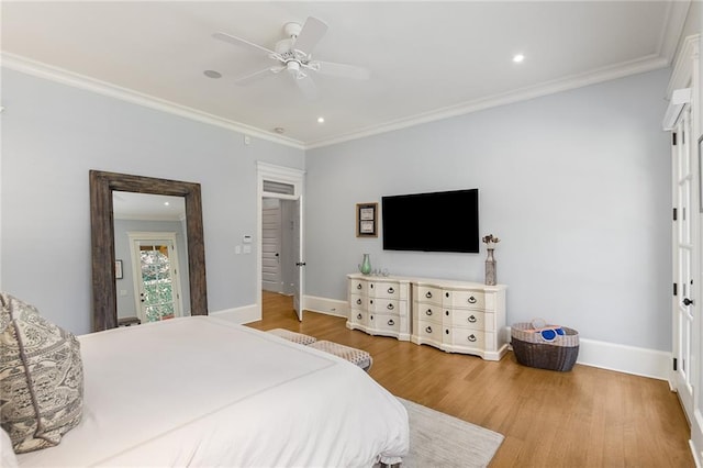 bedroom featuring ceiling fan, wood-type flooring, and ornamental molding