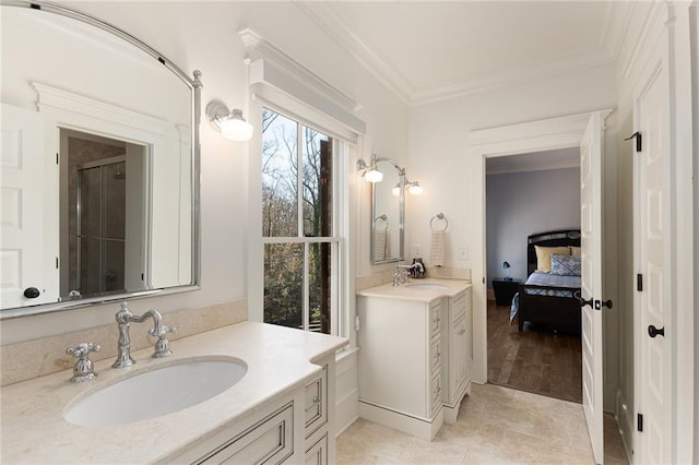 bathroom featuring tile patterned flooring, vanity, and crown molding